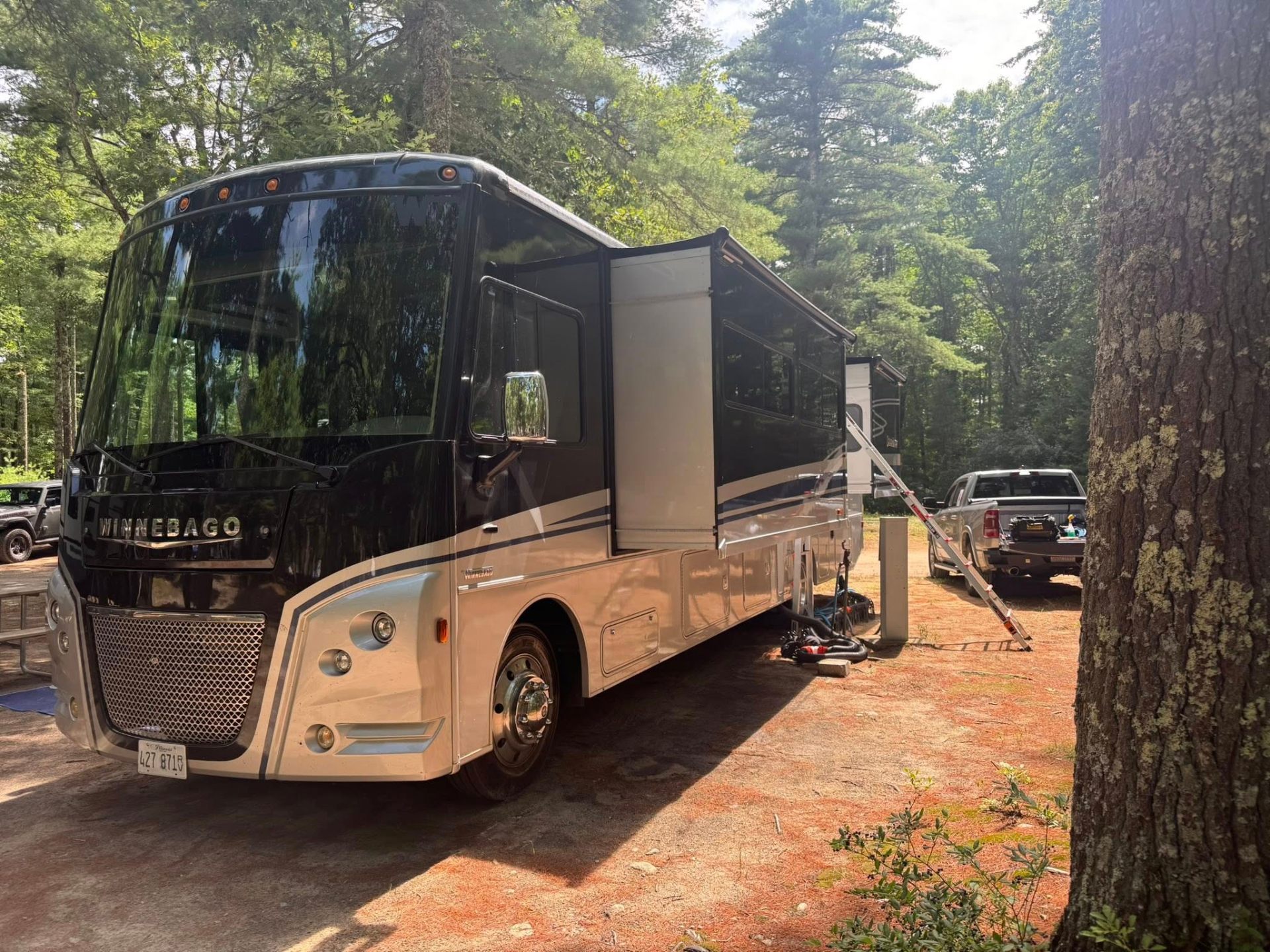 Clean Slate RV performing mobile A/C service on a Winnebago motorhome at a campground
